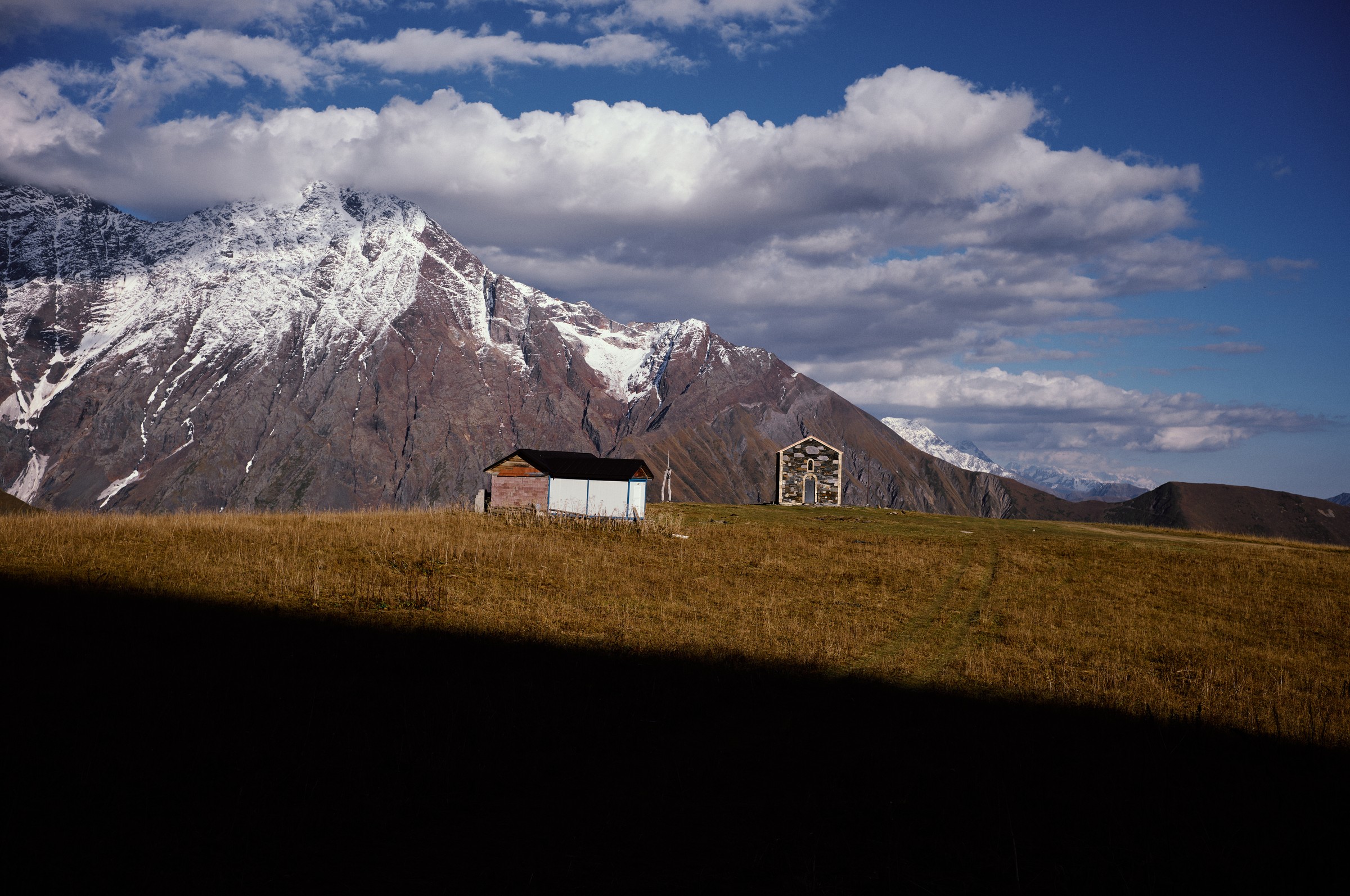 Documentary photograph of children smiling in car, authentic travel photography by Evangelos Tzemis
