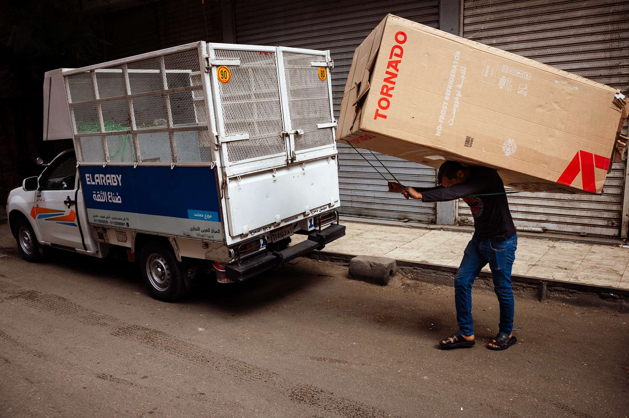 Man carrying a fridge